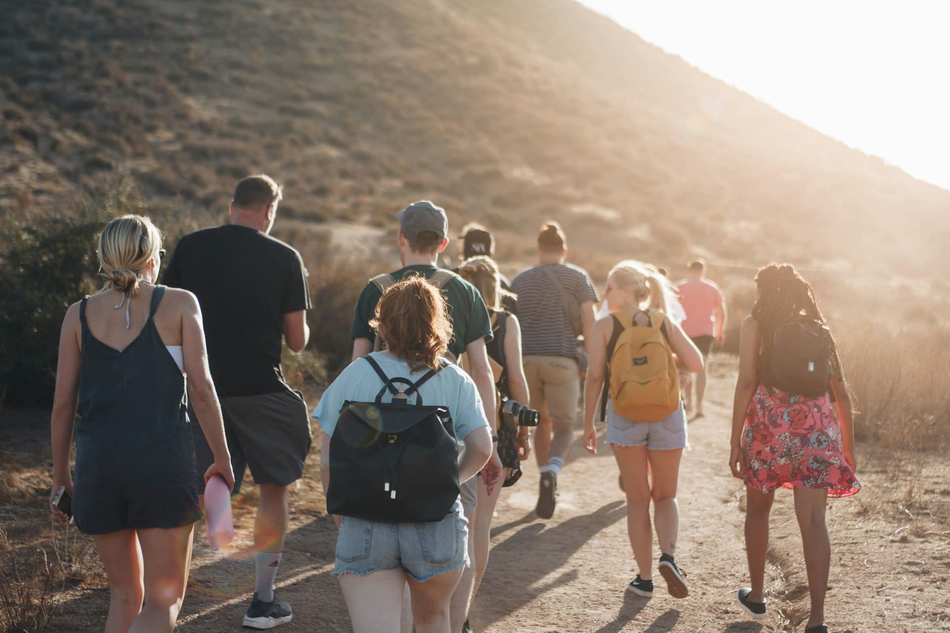 A group hiking at sunset