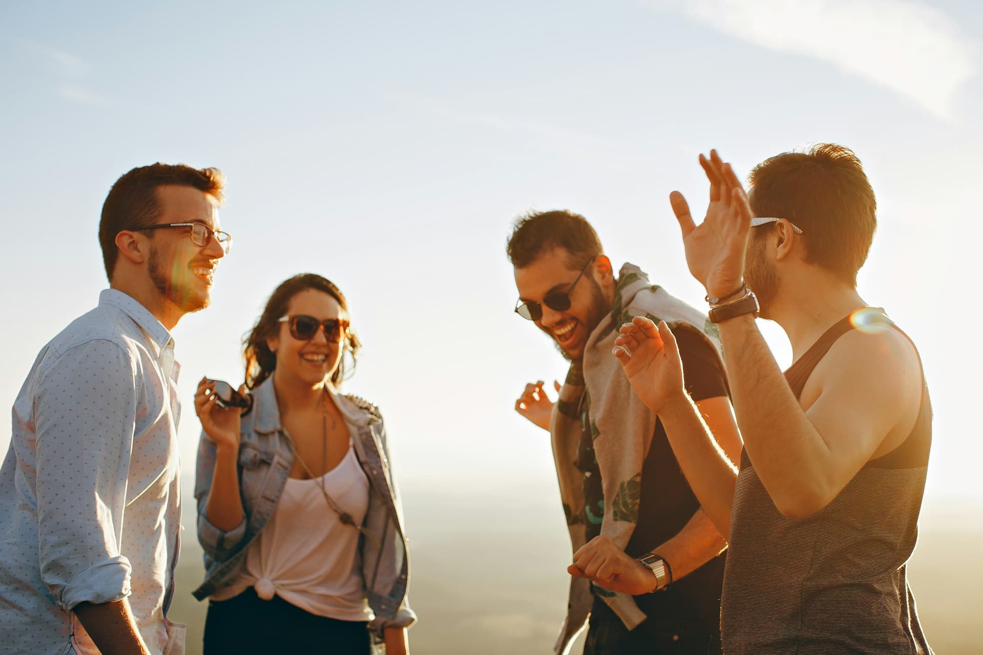 Friends laughing at sunset