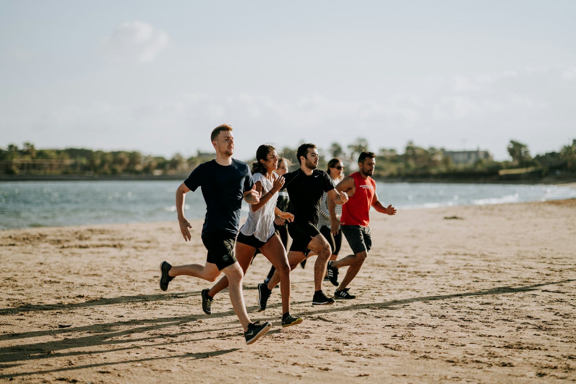 A group running on the beach